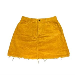 Mustard mini skirt; slightly worn